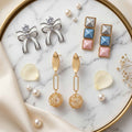 Pack of 3 Designer Earring Combo Set for Women | Bow Crystal Studs, Pastel Geometric Earrings & Gold Drop Danglers | Modern Fashion Jewellery Collection